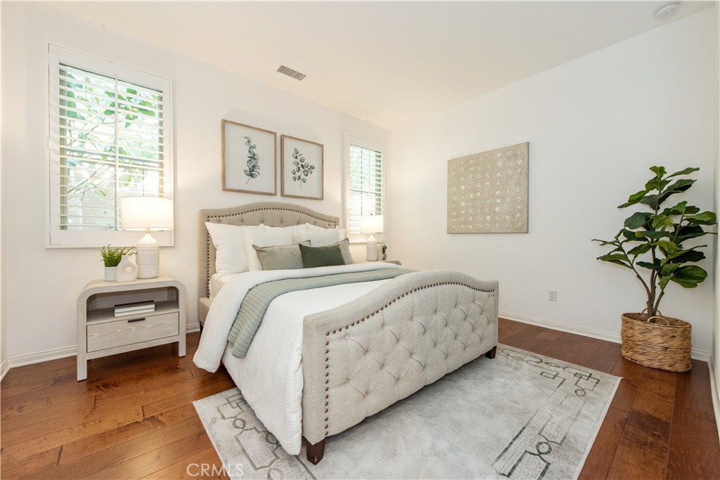238 Shelbourne Irvine, CA 92620 - Photo 10 of 36 a bedroom with a bed and a potted plant