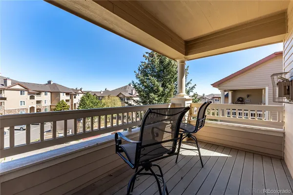 a view of a chairs and table on the deck