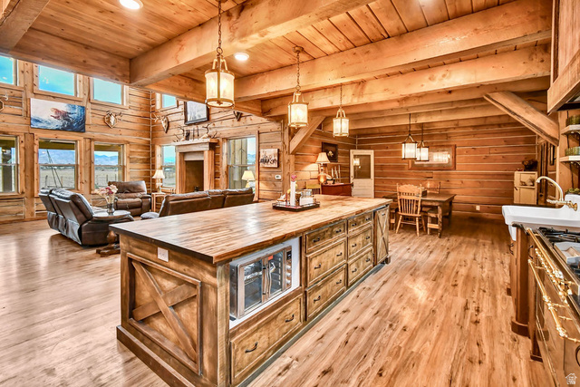 544 East 600 North, Unit 1 Joseph, UT 84739 - Photo 7 of 65 Open concept living area featuring exposed wood beam ceilings and wood-finish flooring