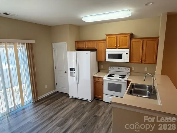 a kitchen with a refrigerator stove and a sink