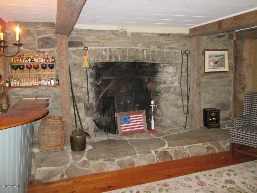 877 Welcome Lake Road Hawley, PA 18428 - Photo 39 of 78 STONE FIREPLACE in TAVERN ROOM