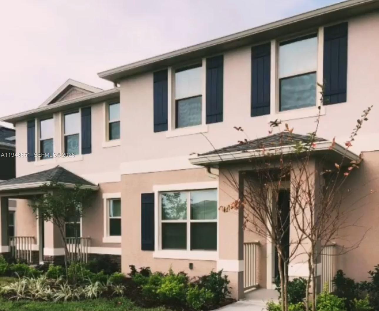 1563 Dawnview Way Kissimmee, FL 34744 - Photo 12 of 14 a front view of a house with a porch
