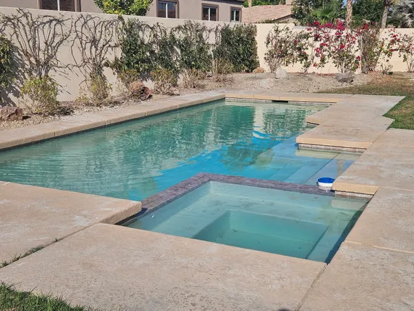 a view of a swimming pool with an outdoor space