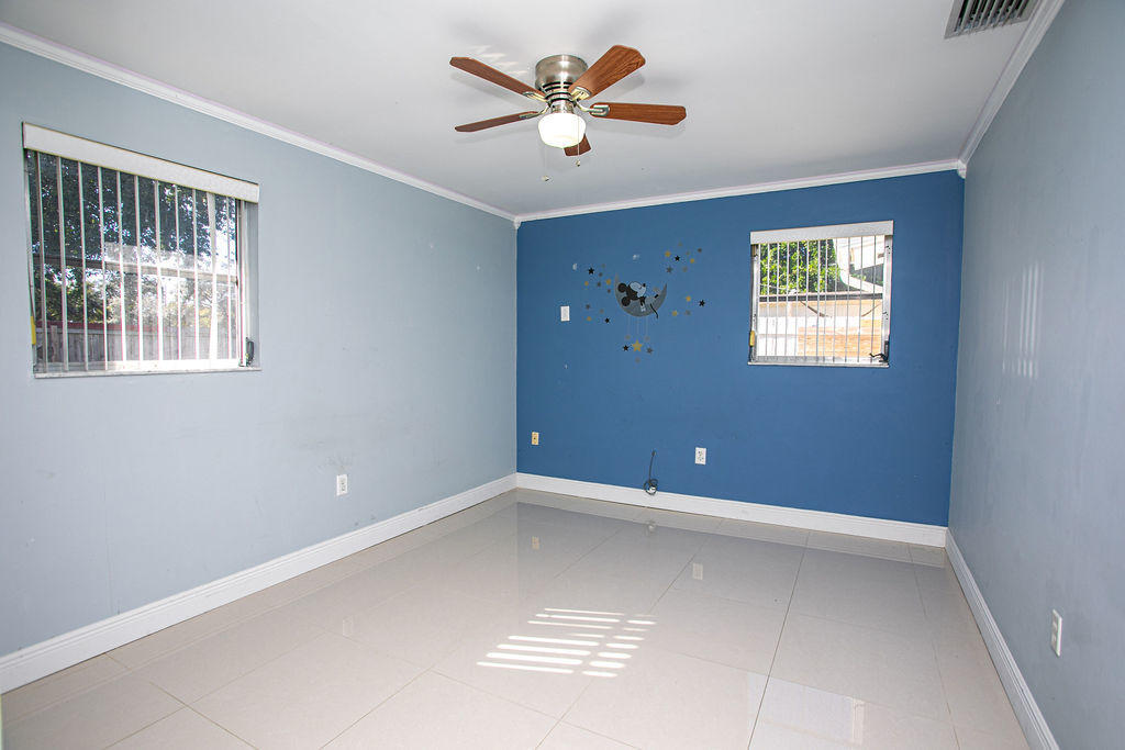 4092 Rochester Street Palm Beach Gardens, FL 33410 - Photo 21 of 28 a view of an empty room with a window