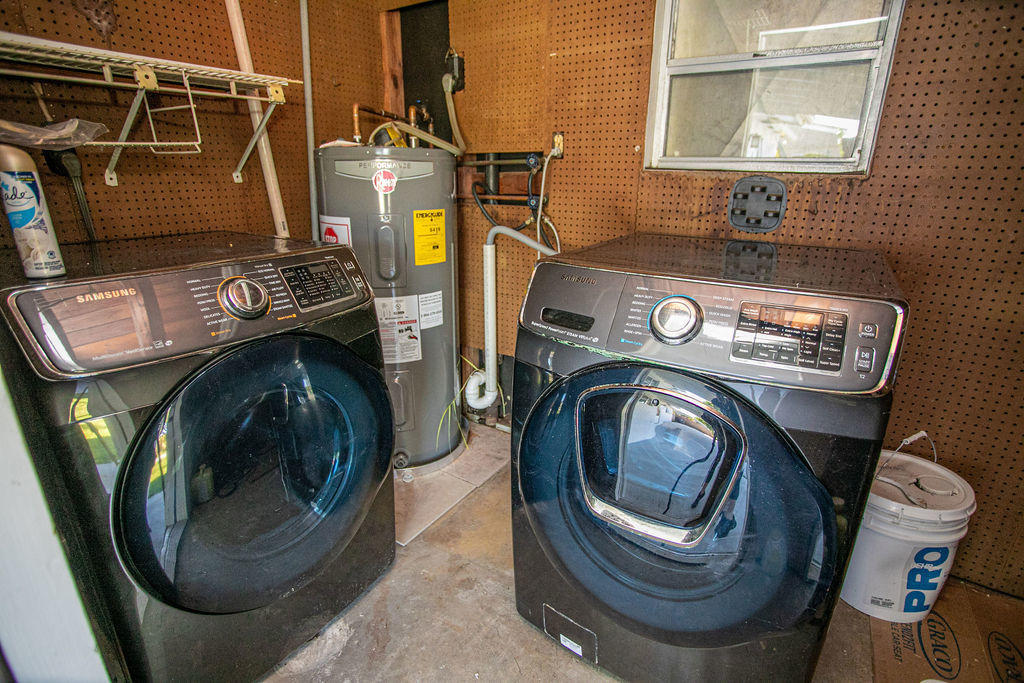 4092 Rochester Street Palm Beach Gardens, FL 33410 - Photo 25 of 28 a utility room with dryer and washer