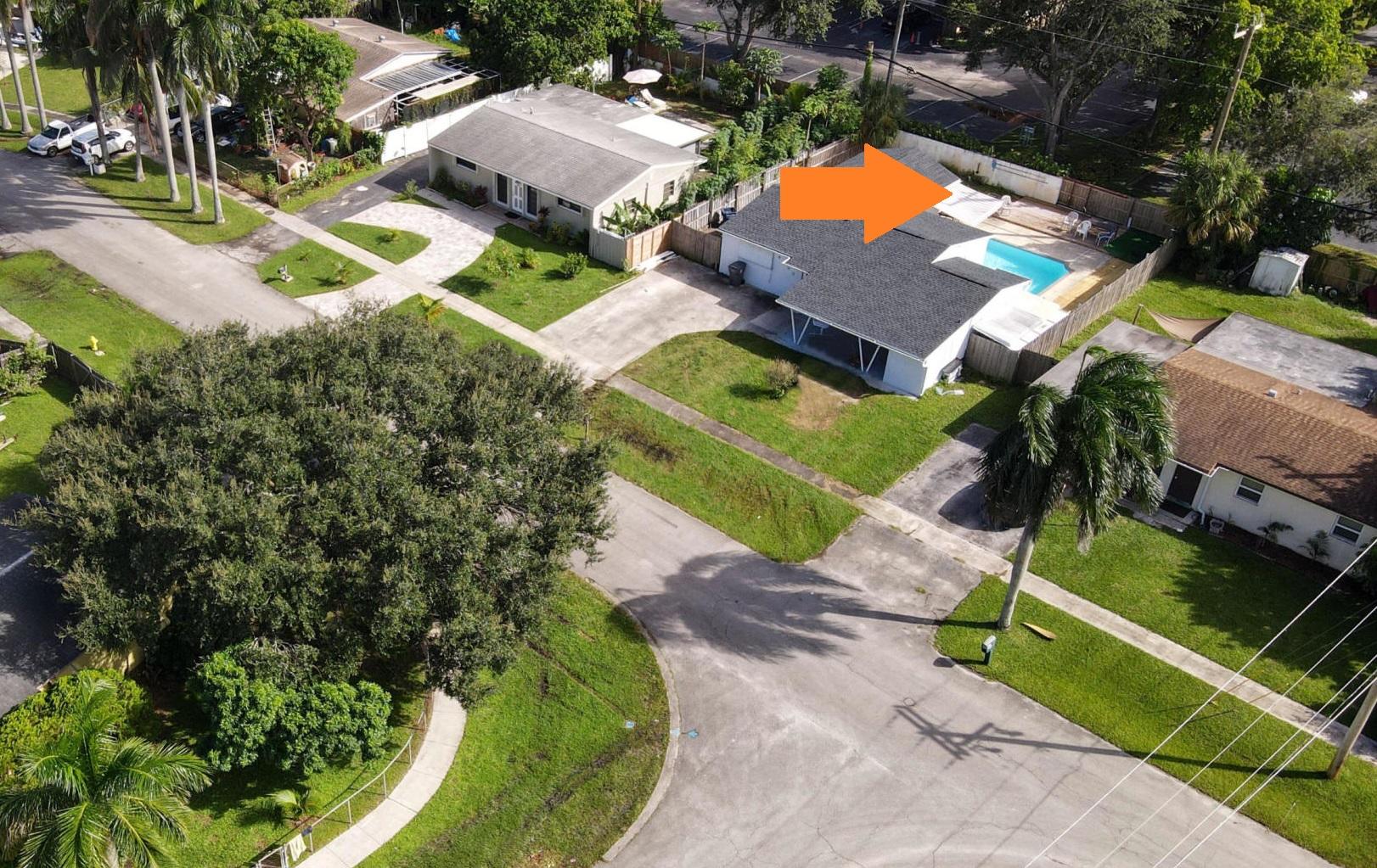 4092 Rochester Street Palm Beach Gardens, FL 33410 - Photo 28 of 28 an aerial view of a house with a garden and swimming pool