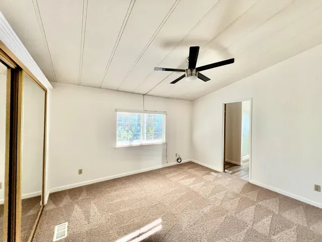 a view of room with ceiling fan