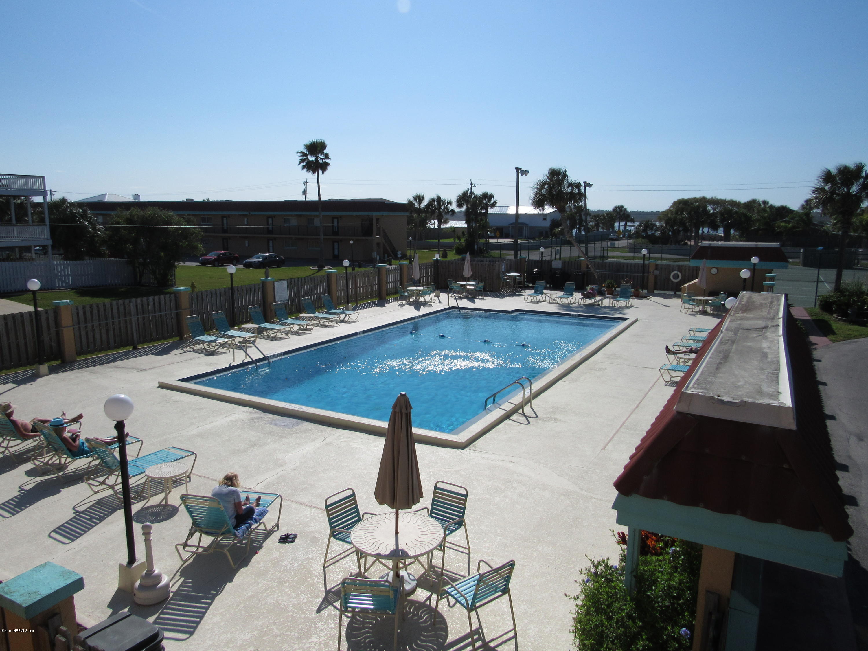 7175 South A1a Street, Unit B212 St. Augustine, FL 32080 - Photo 1 of 29 a view of swimming pool with seating space