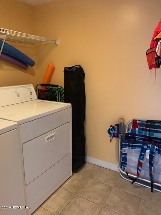 7175 South A1a Street, Unit B212 St. Augustine, FL 32080 - Photo 17 of 29 a utility room with dryer and washer