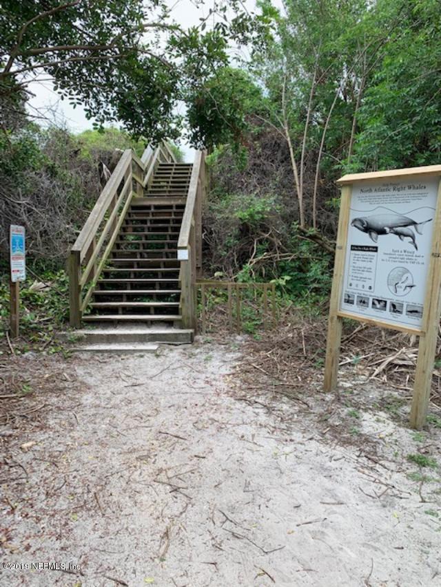 7175 South A1a Street, Unit B212 St. Augustine, FL 32080 - Photo 24 of 29 a view of a house with a yard