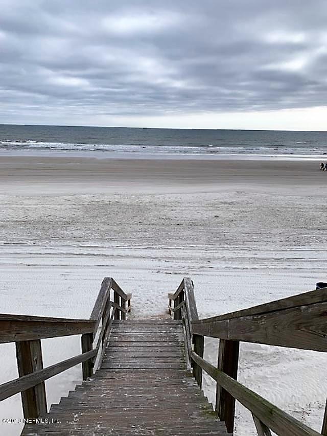 7175 South A1a Street, Unit B212 St. Augustine, FL 32080 - Photo 26 of 29 a view of a chairs and table on the terrace