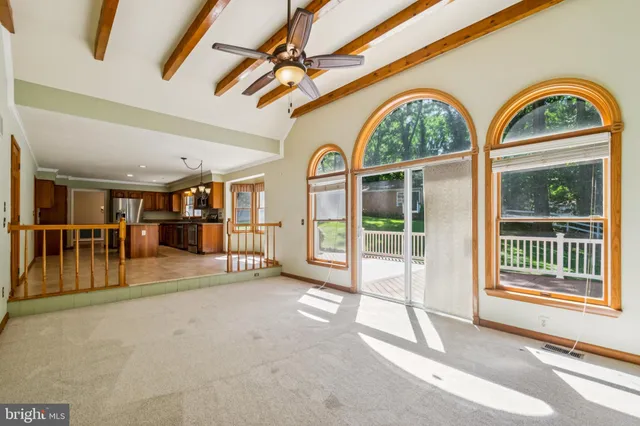 a view of a hallway with a large window and front door