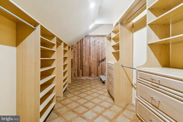 a bathroom with a tub and shower