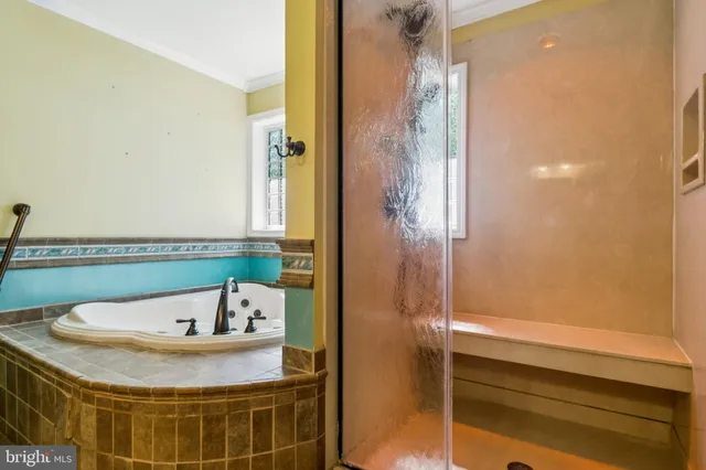 a bathroom with a bathtub and window