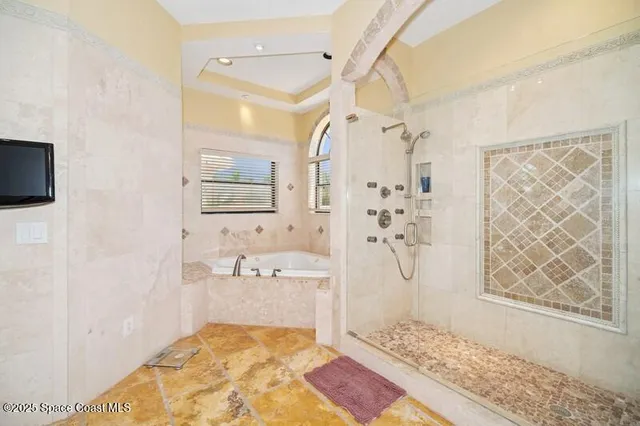 a bathroom with a sink mirror toilet and shower