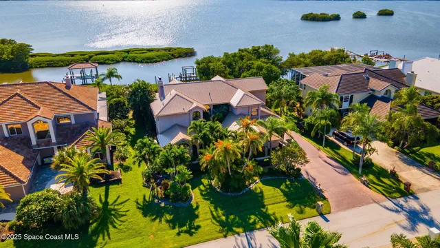 an aerial view of multiple houses with yard