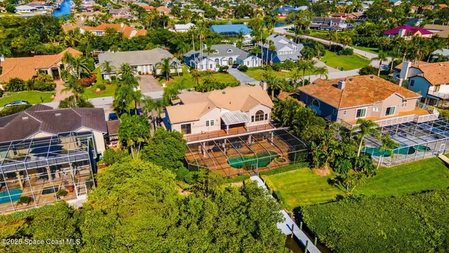 an aerial view of multiple houses with yard