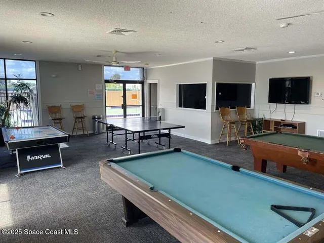 a view of a lake with a table and chairs