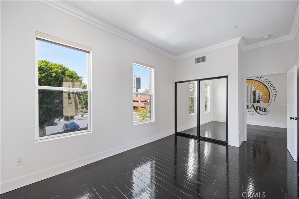 190 West 3rd Street Santa Ana, CA 92701 - Photo 5 of 18 Bedroom 1 has a great view of the Downtown area and gets a great cross breeze. Mirrored closet doors.