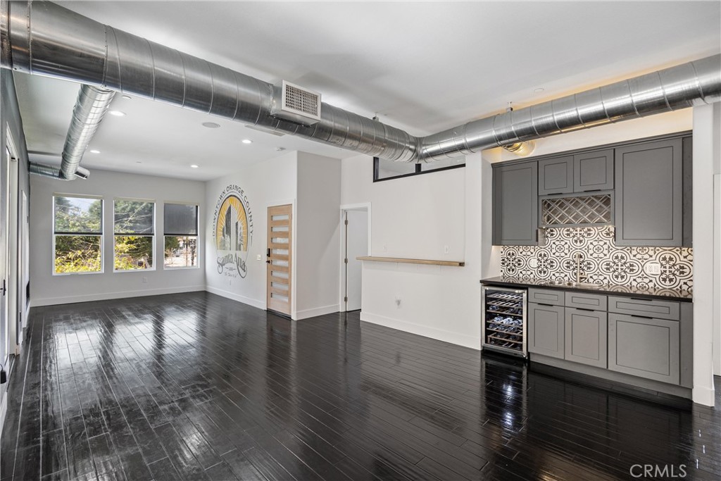 190 West 3rd Street Santa Ana, CA 92701 - Photo 6 of 18 Living room and dining area with wet bar