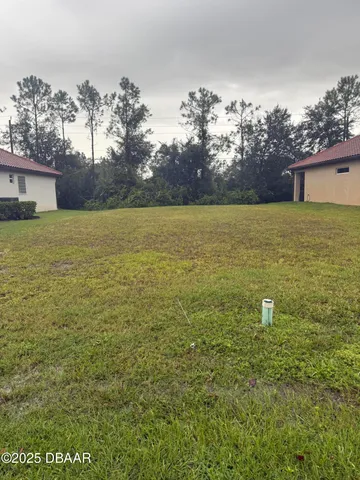 a view of a yard with an outdoor space