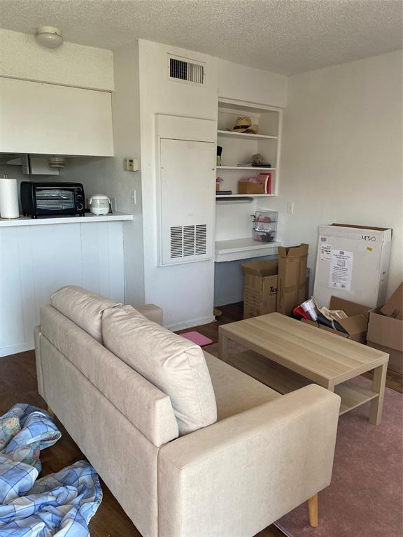 a living room with furniture and flat screen tv