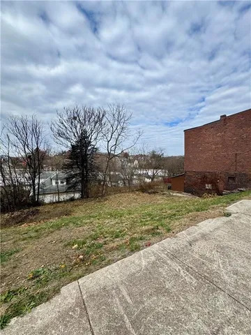 a view of a hallway with a large white bed