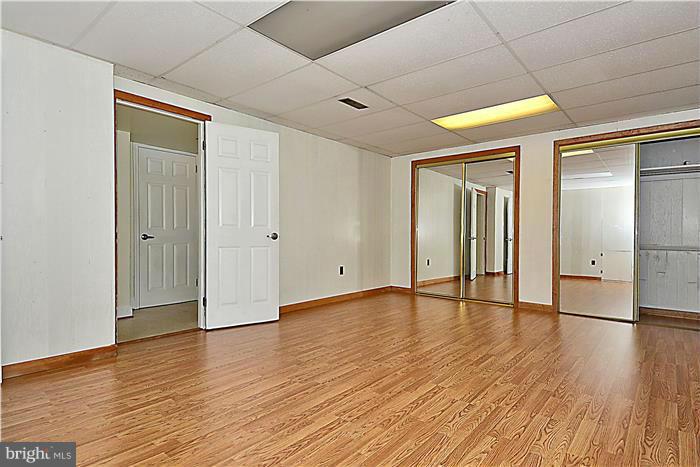 6716 Garrett Road Derwood, MD 20855 - Photo 21 of 30 a view of empty room with wooden floor