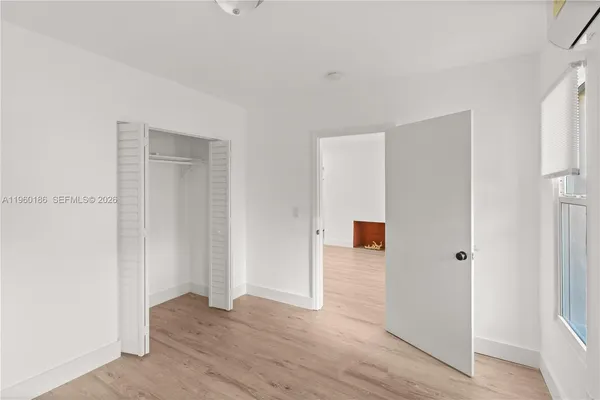 a view of a livingroom with wooden floor