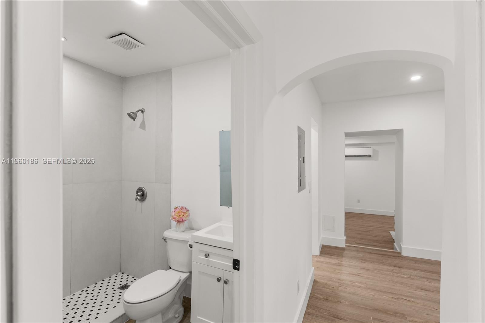 2508 Southwest 10th Street, Unit 2508 Miami, FL 33135 - Photo 15 of 26 a bathroom with a toilet a sink and shower