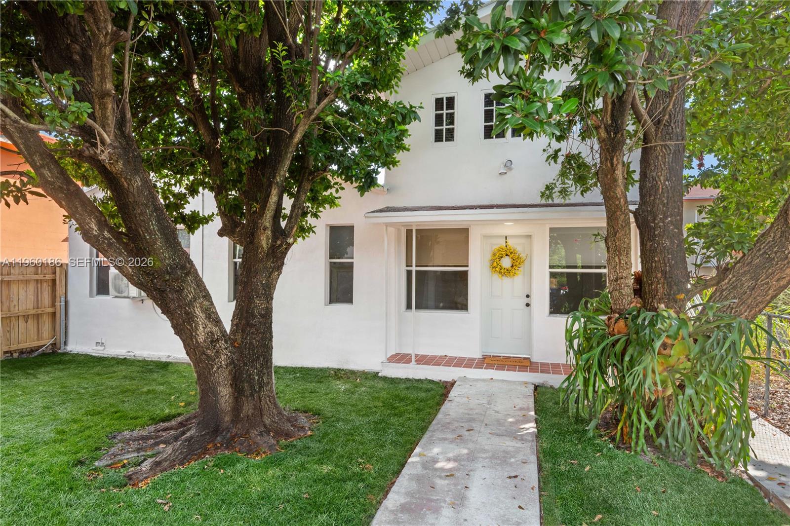 2508 Southwest 10th Street, Unit 2508 Miami, FL 33135 - Photo 2 of 26 a front view of a house with garden