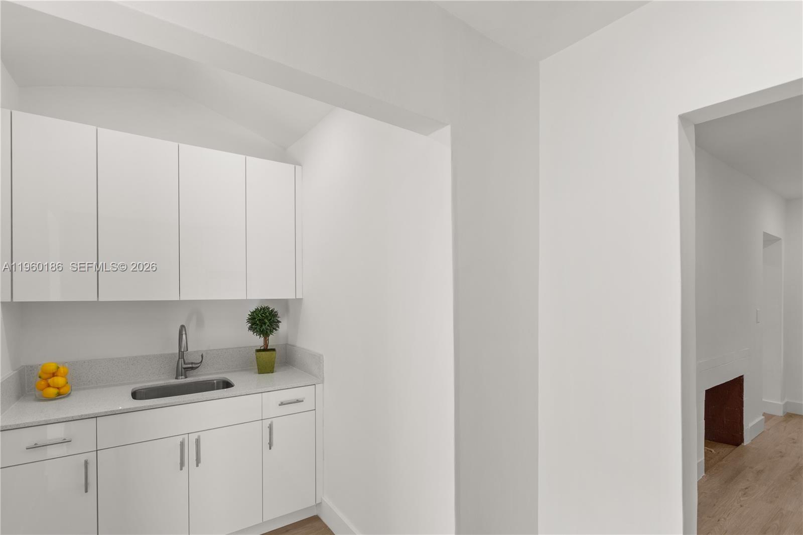 2508 Southwest 10th Street, Unit 2508 Miami, FL 33135 - Photo 21 of 26 a kitchen with a sink and cabinets