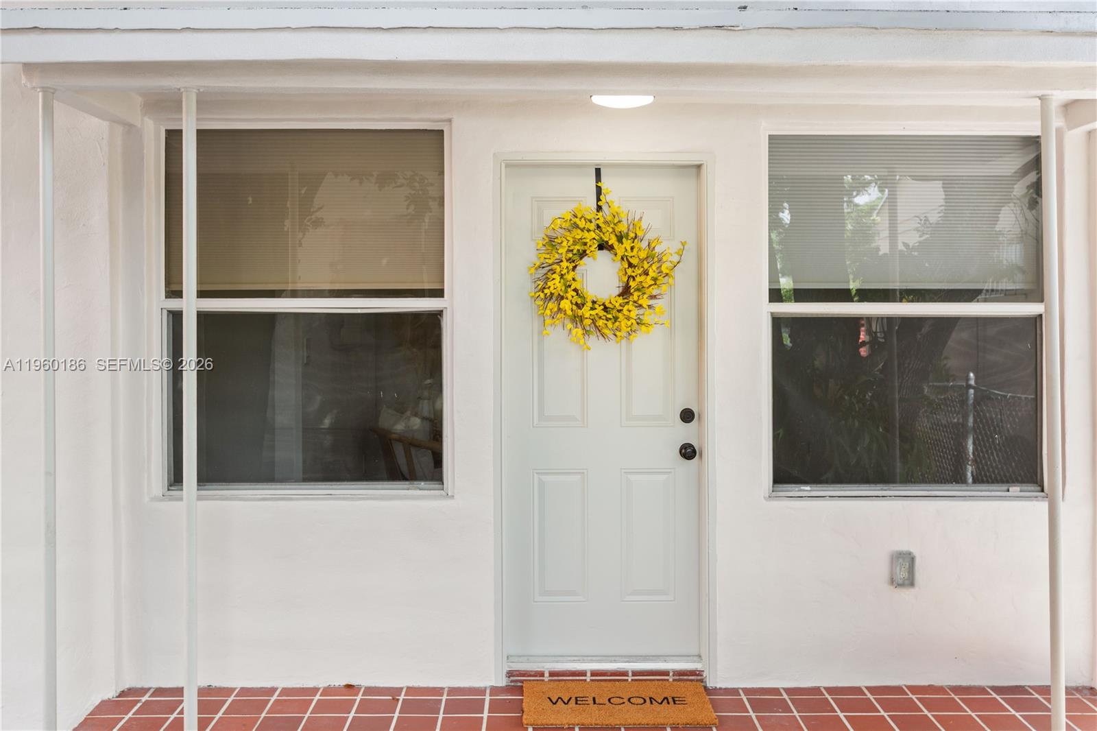2508 Southwest 10th Street, Unit 2508 Miami, FL 33135 - Photo 3 of 26 a view of a hallway with wooden floor and front door