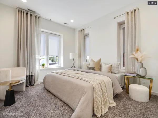 a bedroom with bed and a couch