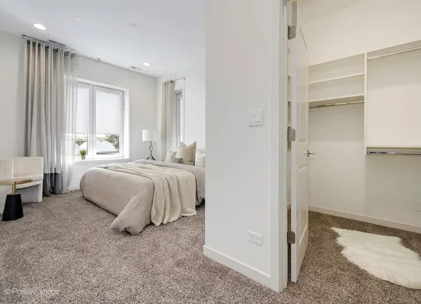 a bedroom with a bed and a cabinets