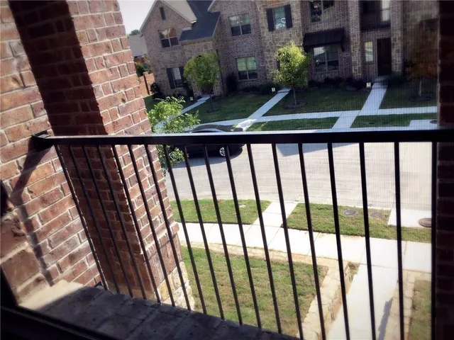 a balcony with wooden floor