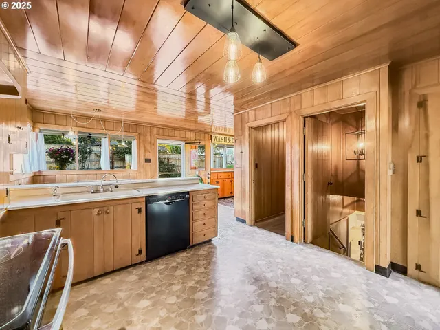 a large kitchen with a large window