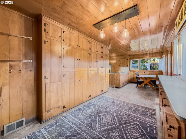 a living room with furniture a window and a glass door