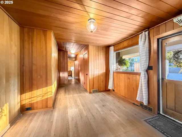 a view of gallery with wooden floor