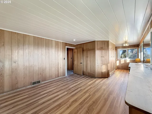 a view of a livingroom with wooden floor