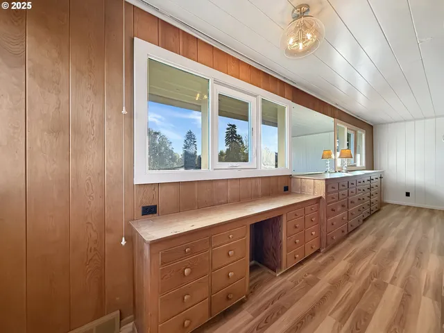 a bathroom with a double vanity sink and a mirror
