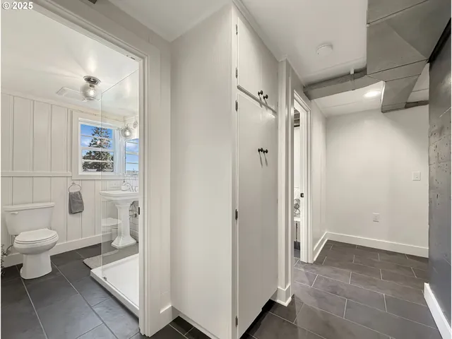 a bathroom with a glass door shower