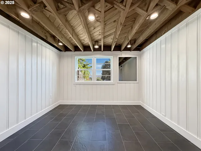 a view of hallway with windows