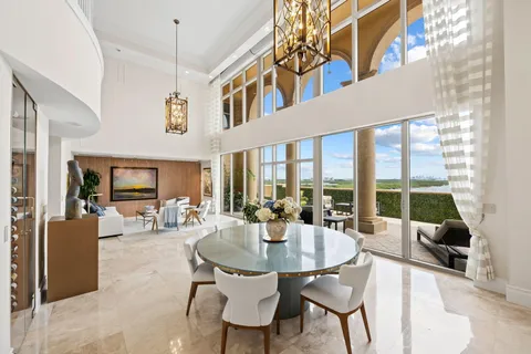 a dining room with furniture window and outside view