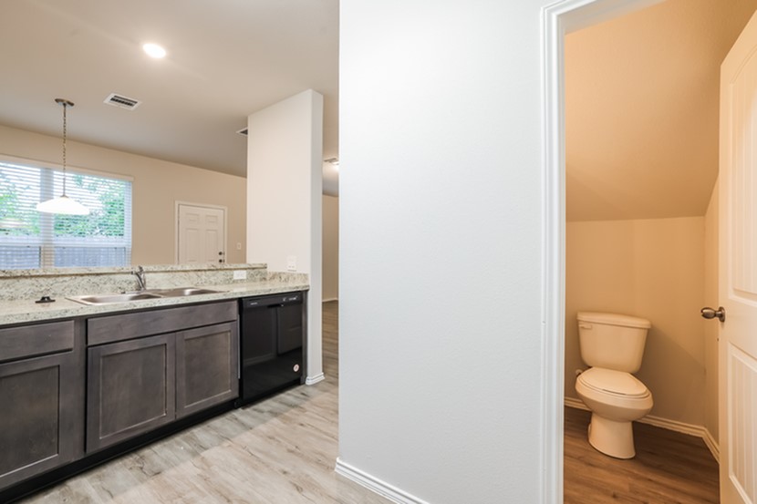 2647 Bouvardia Way Houston, TX 77073 - Photo 3 of 12 a bathroom with a toilet sink and mirror