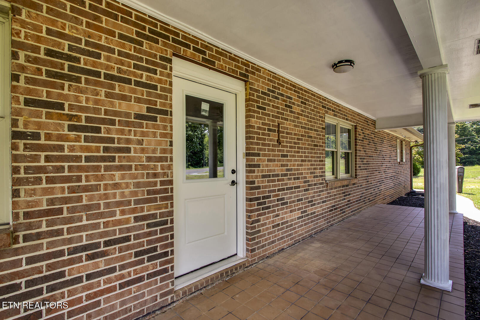 8055 Steekee Creek Road Loudon, TN 37774 - Photo 6 of 60 06_SteekeeCreekRoad_8055_FrontPorch02-En