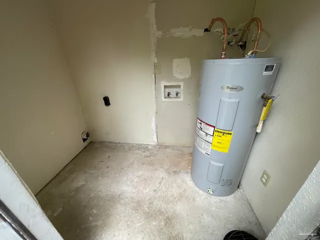 a kitchen with granite countertop a sink and a stove