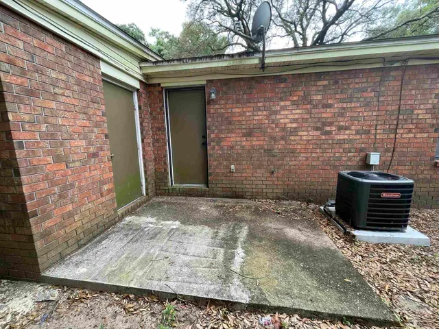a backyard of a house with seating space