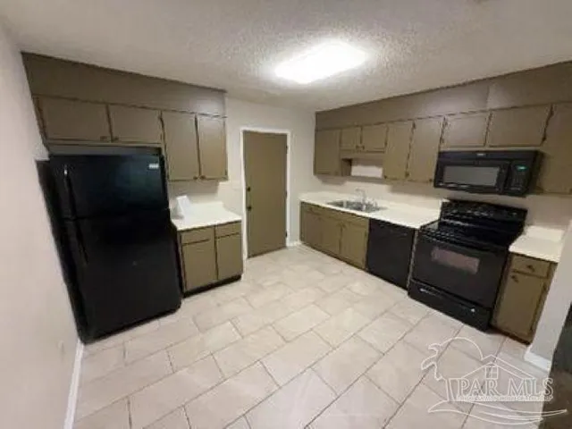 an empty room with a ceiling fan and window