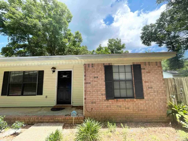 a bathroom with a sink a toilet a mirror and vanity